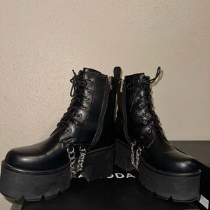 Black chained platform boots, in good condition, in its original box